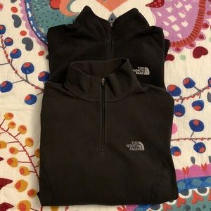 2 North Face 1/4 zip fleece in black, Size Small. Good condition!